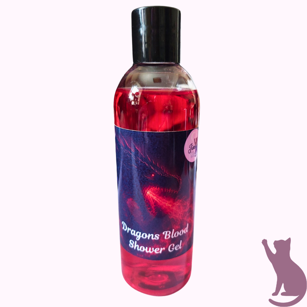 A bottle of Dragon's Blood Shower Gel with a black cap and a dark blue label featuring red dragon artwork, shown against a pale pink background.