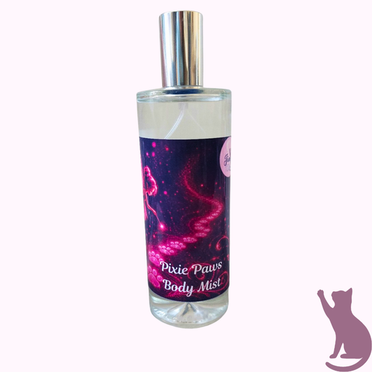 Pixie Paws Body Mist in a clear glass bottle with a silver spray cap, featuring a purple and pink galaxy-themed label, set against a pale pink background.